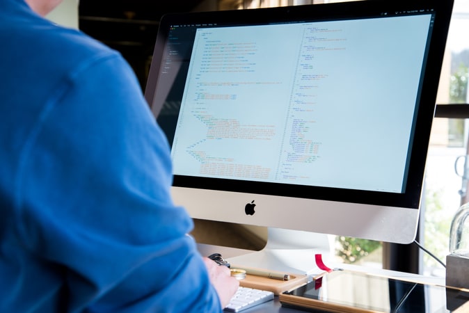 Man in front of a Computer screen